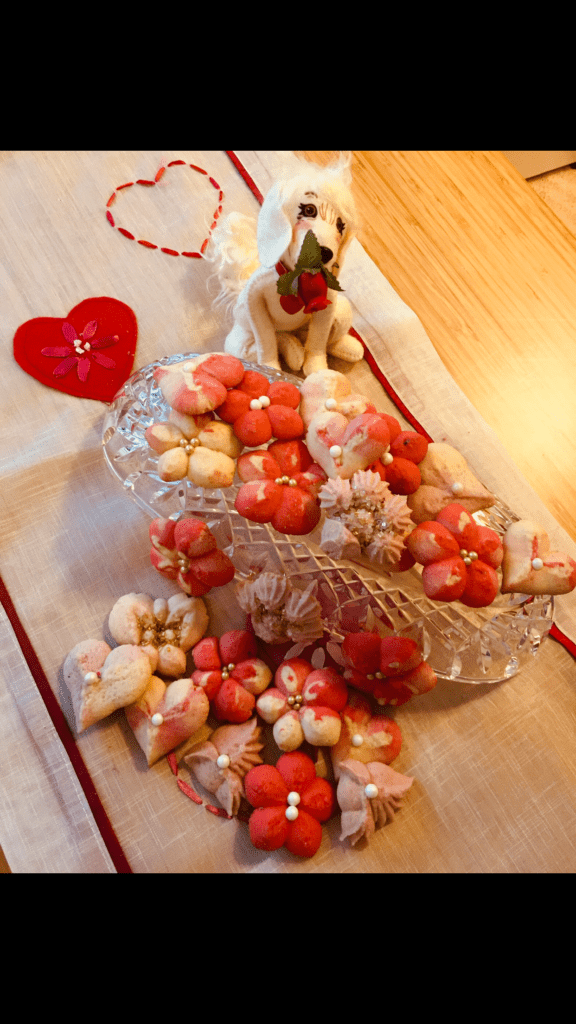 A table with some cookies and strawberries on it