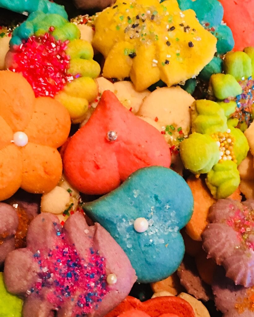A pile of colorful cookies with different shapes and colors.