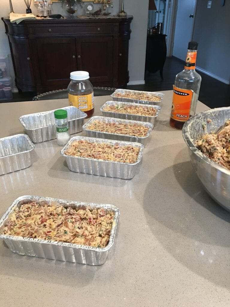 A table with several pans of food on it.