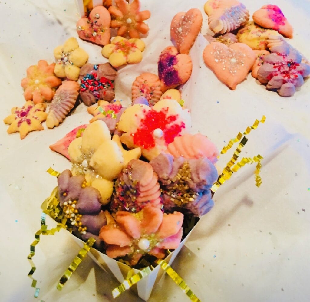 A bunch of different colored cookies on the table