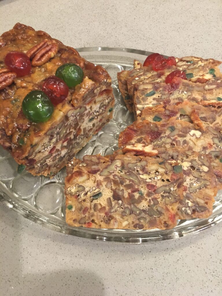 A plate of food with some nuts and fruit on it