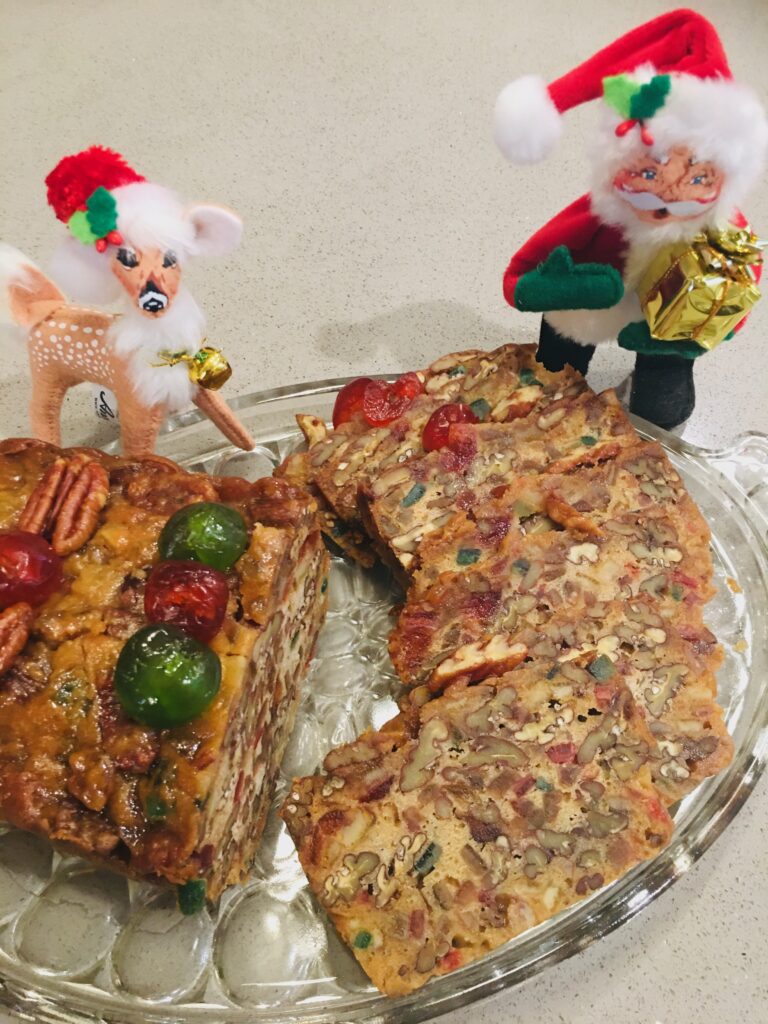 A plate with some food on it and two small figurines