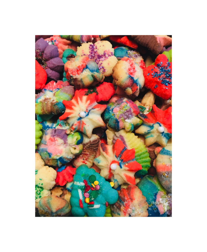 A pile of colorful cookies with different colors.