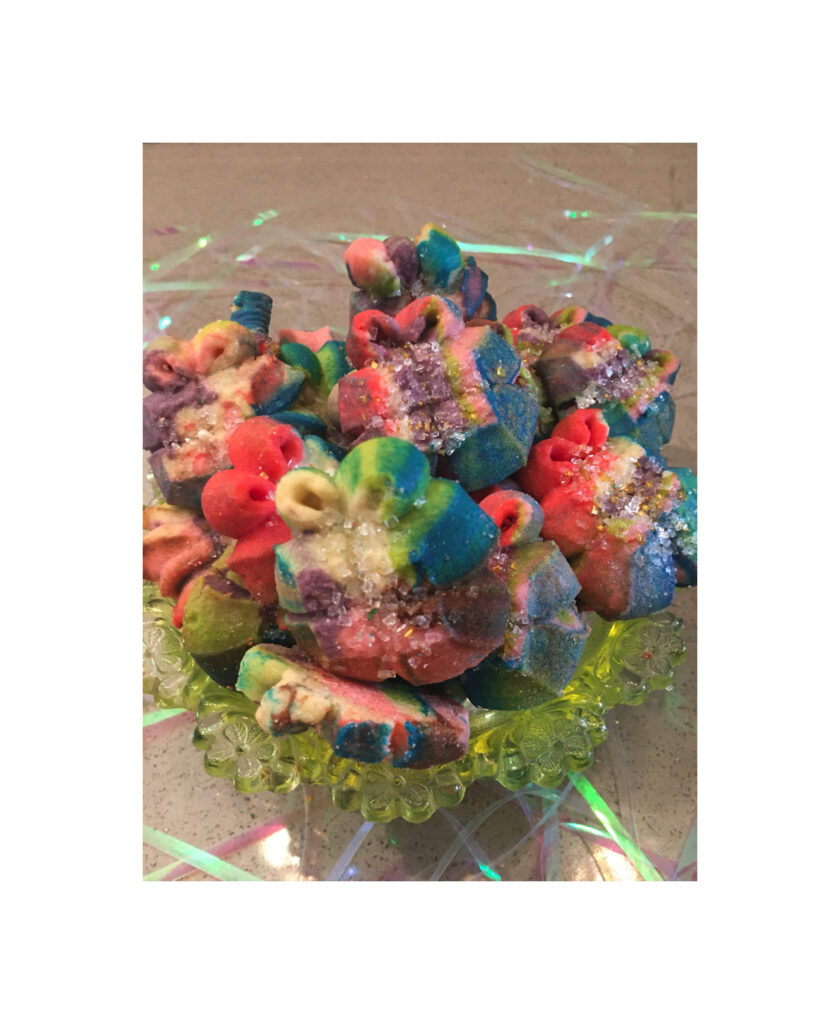 A bowl of colorful candy on top of a table.