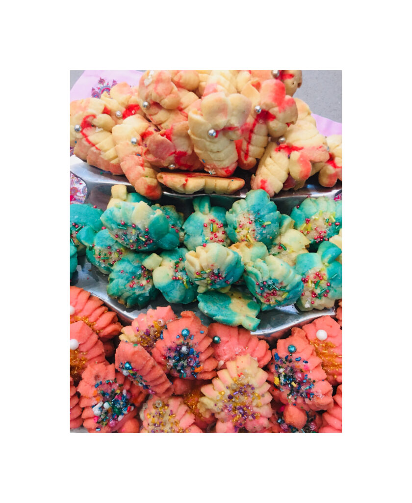 A pile of colorful cookies sitting on top of each other.