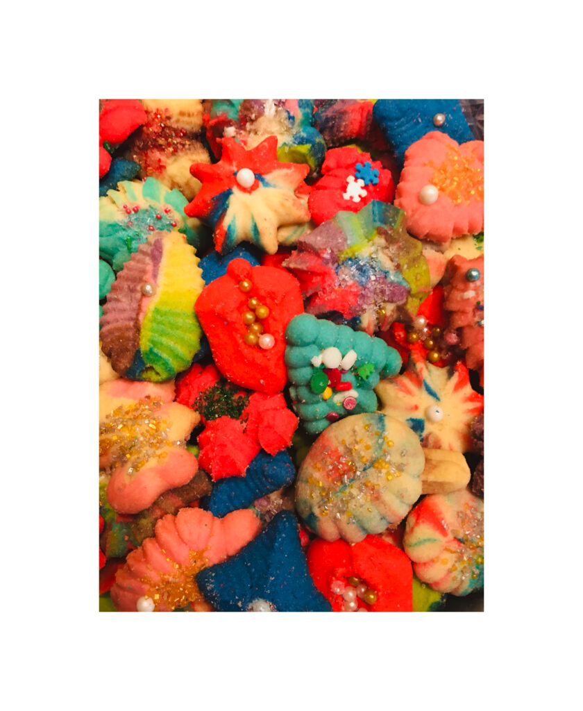 A bunch of colorful cookies are piled together