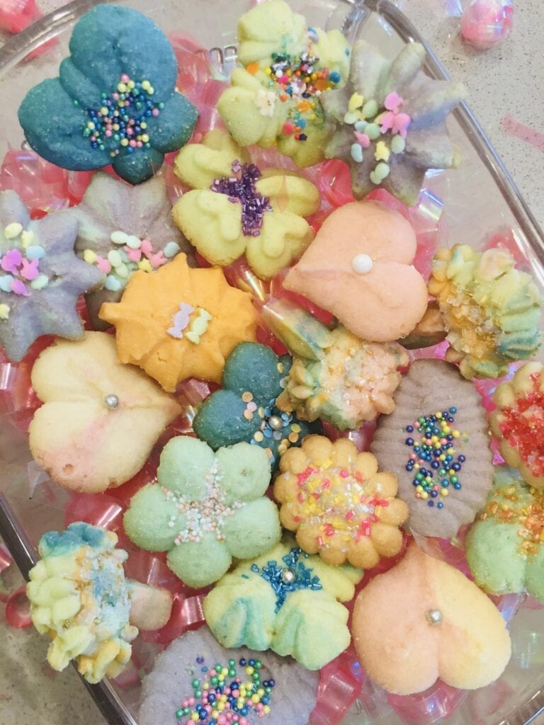 A bunch of cookies that are in the shape of flowers