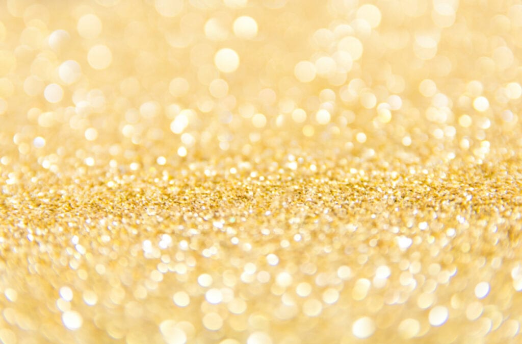A close up of some gold sparkles