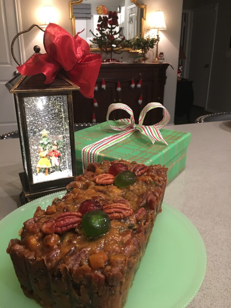 A green plate with a cake on it