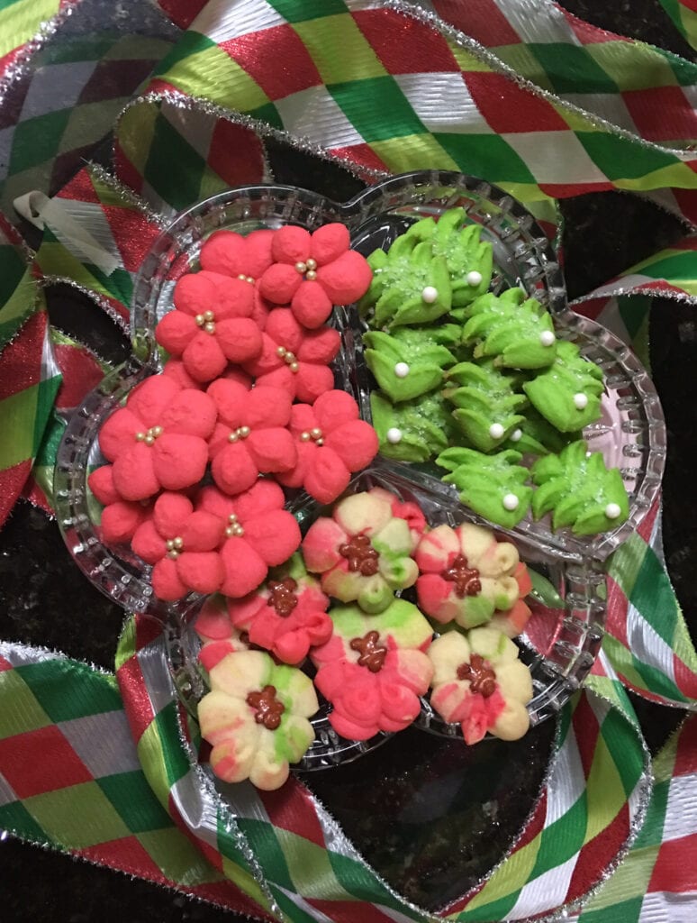 A bowl of fruit is shown with other fruits.